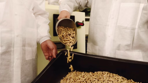pouring pellets into bin