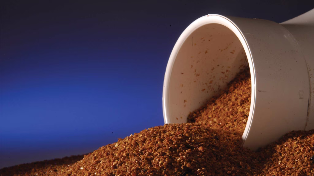white pipe with grains pouring out