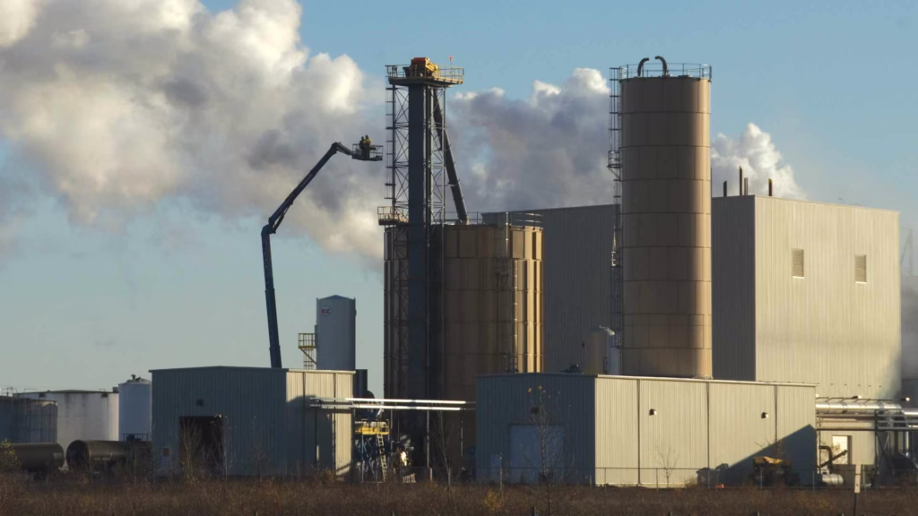 smoke blowing out of factory