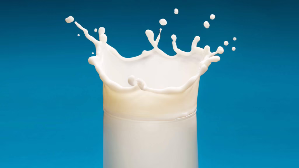 glass of milk with splashes