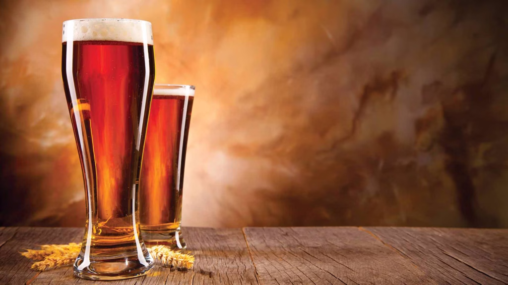 2 tall glasses of beer
