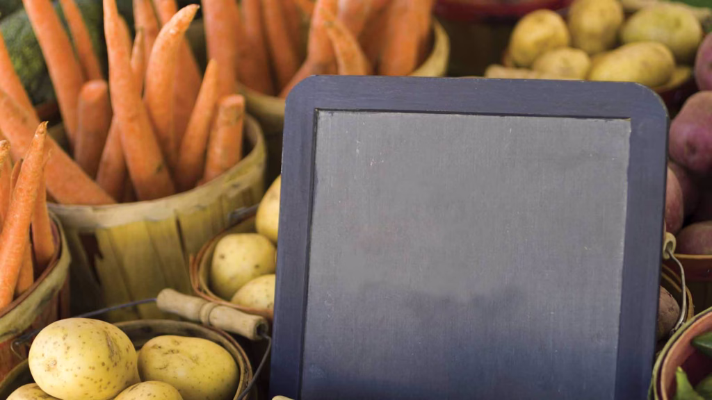chalkboard in a pile of vegetables