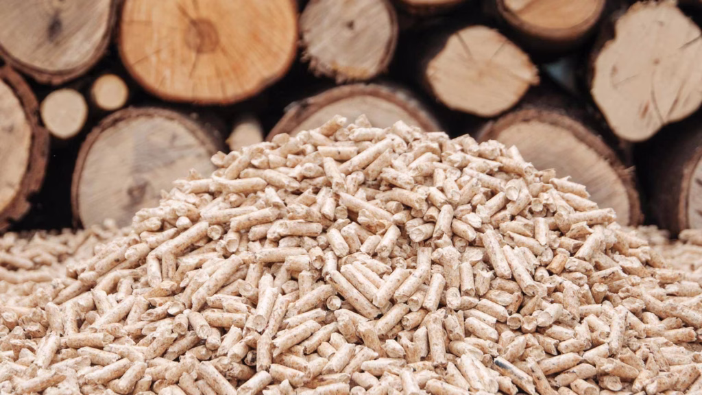 stack of wood with pile of pellets in front