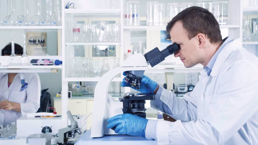 scientist with microscope