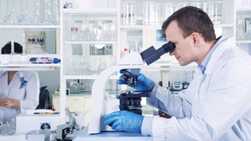 scientist with microscope