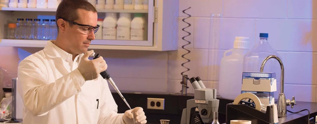 Scientist working in a pilot plant laboratory.